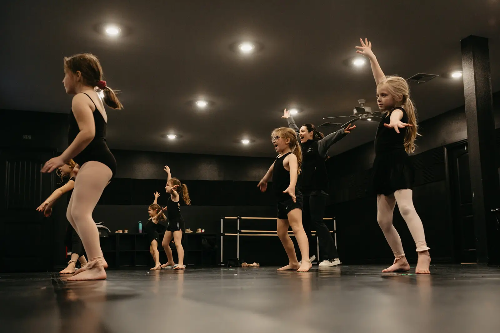 Dance class with multiple little girls dressed in black